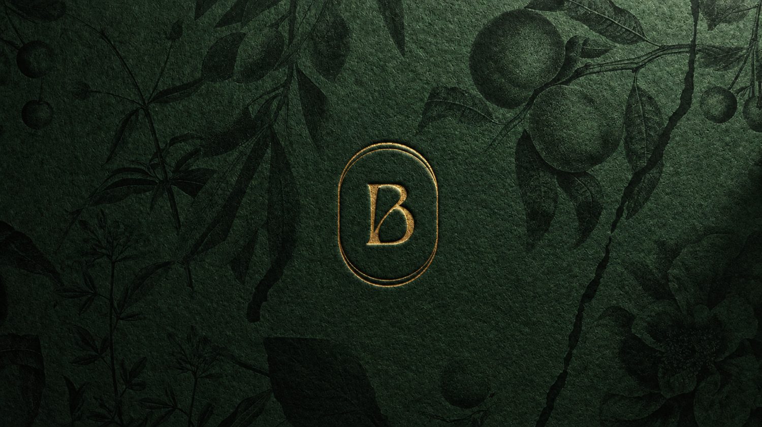 Gold Bodoá monogram on a deep green surface with botanical illustrations