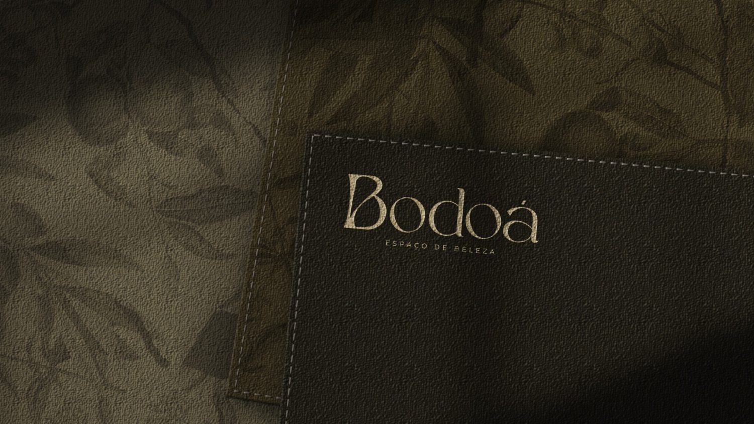 Bodoá business card on dark fabric