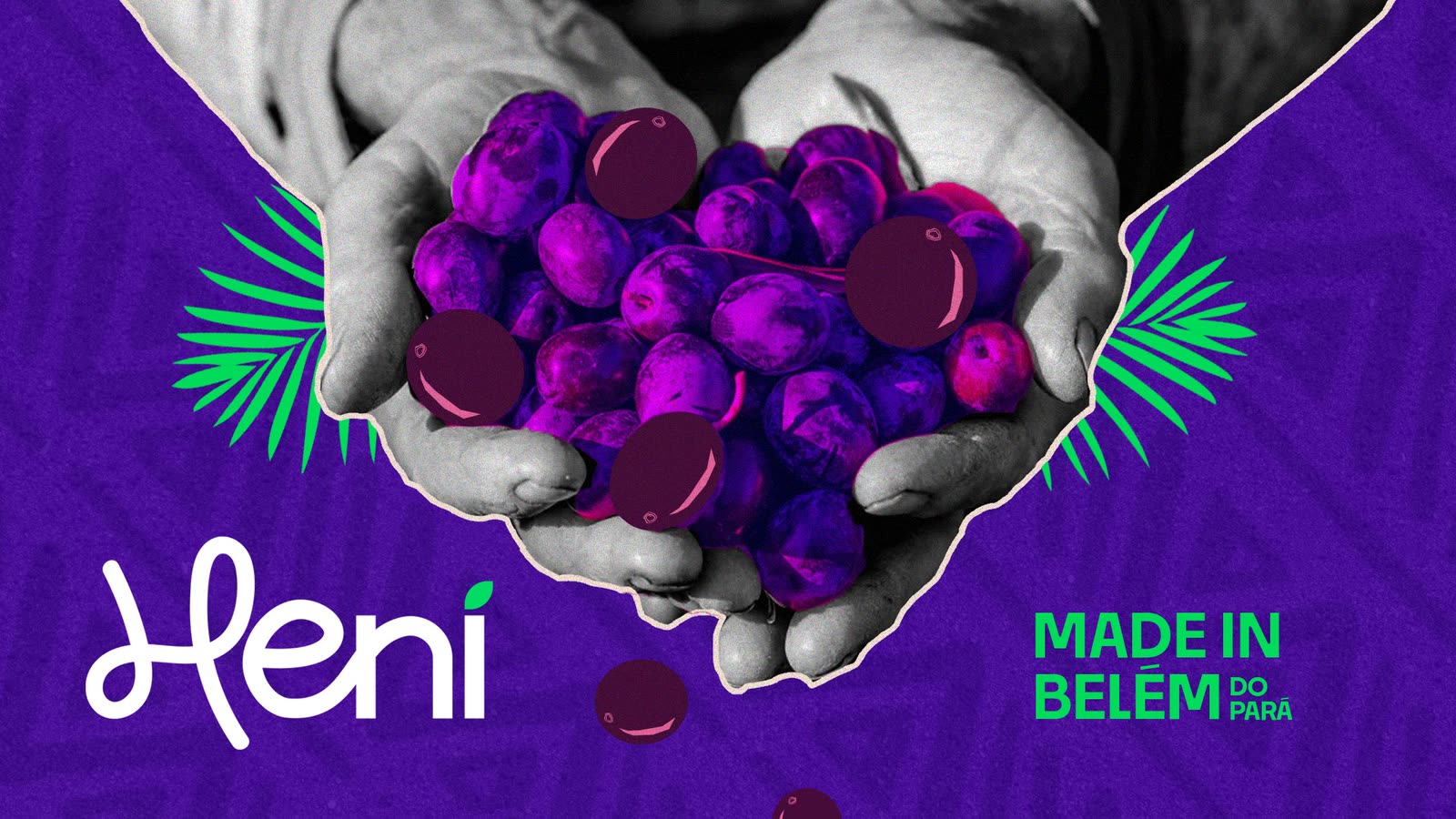Hands full of açaí berries with the Heni logo