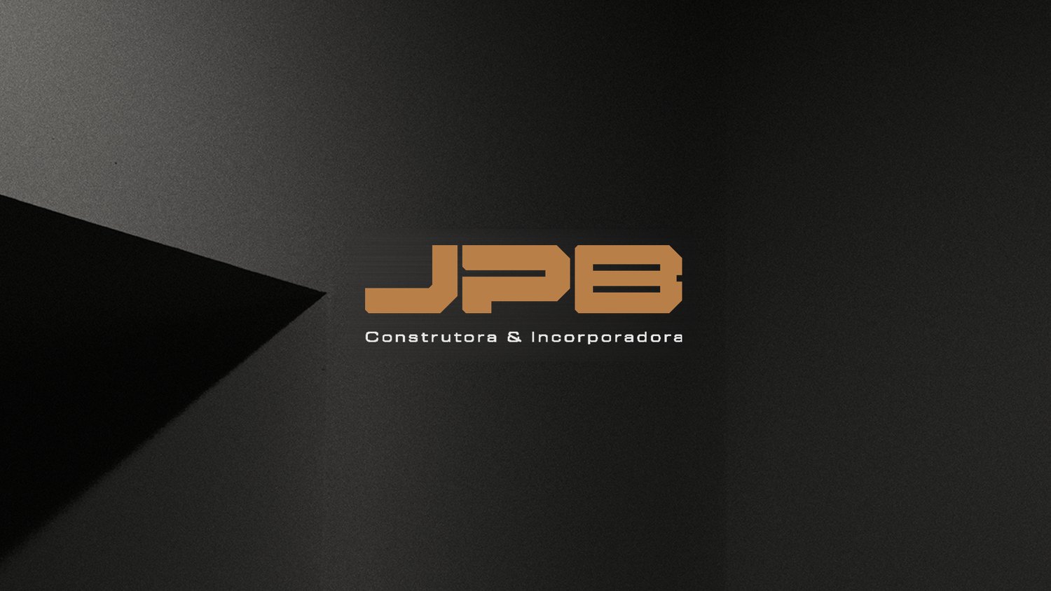 JPB logo in copper on a dark architectural wall