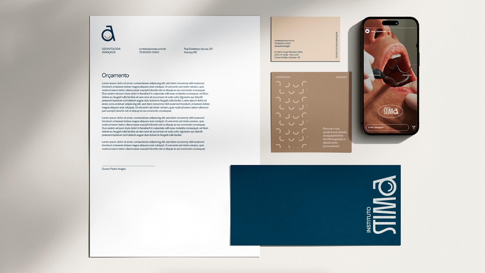The STIMA stationery: letterhead, cards, envelope and a phone with social posts
