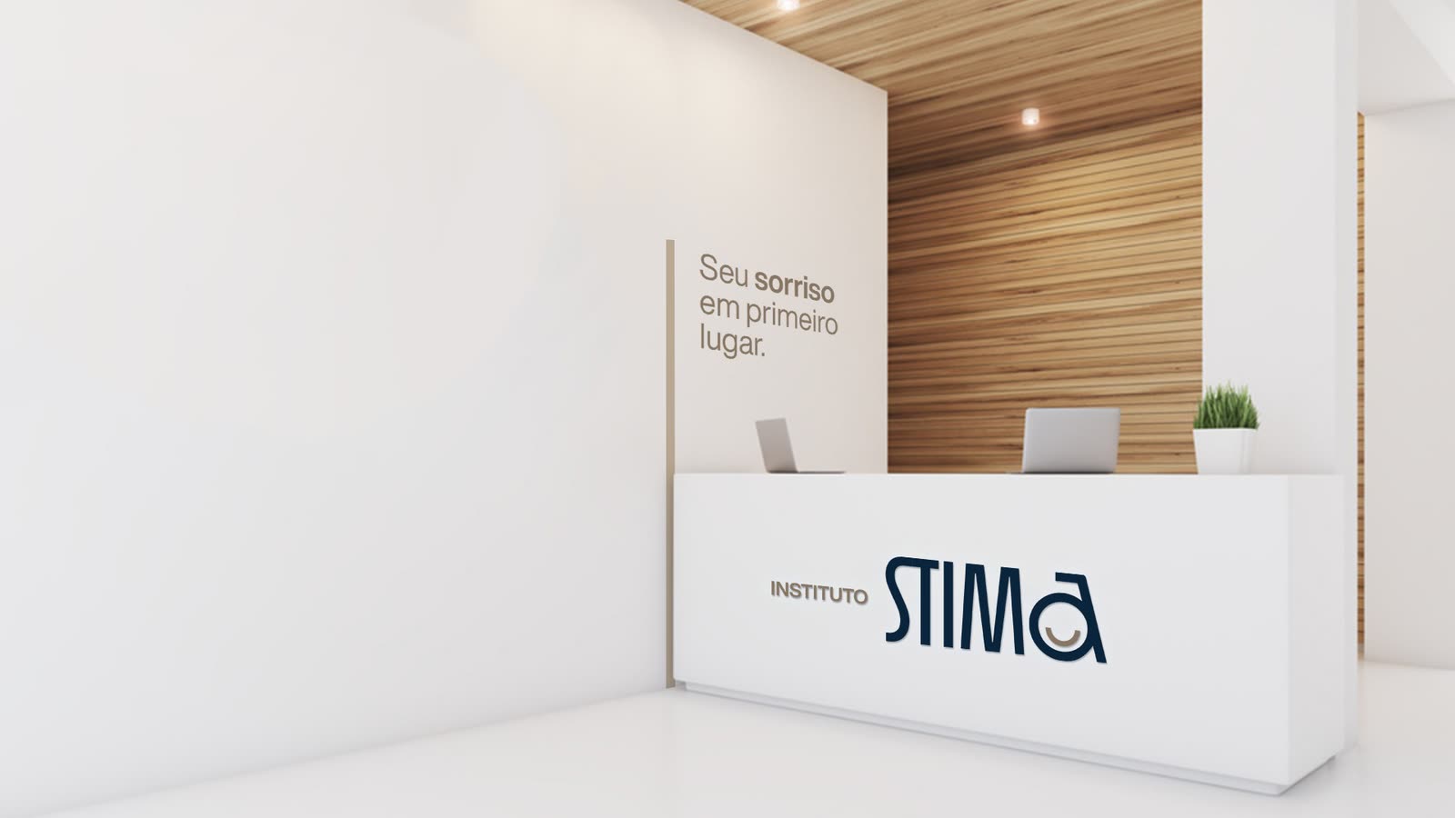 The STIMA reception desk with the logo and the slogan on the wall